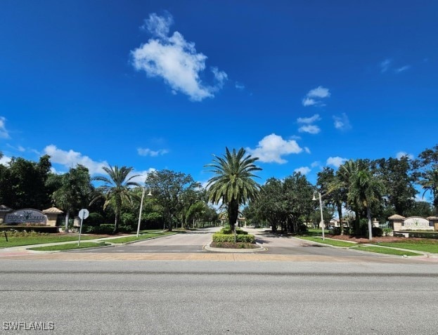 5291 Laurel Oak Ct, North Port, FL 34287 - view of street featuring sidewalks, traffic signs, curbs, and street lights