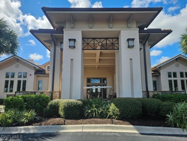 5291 Laurel Oak Ct, North Port, FL 34287 - entrance to property featuring stucco siding and stone siding