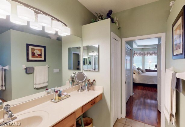 bathroom with vanity and hardwood / wood-style floors