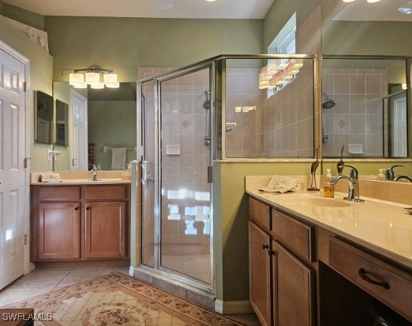 bathroom with vanity, tile patterned flooring, and walk in shower