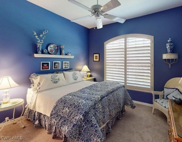 carpeted bedroom featuring ceiling fan