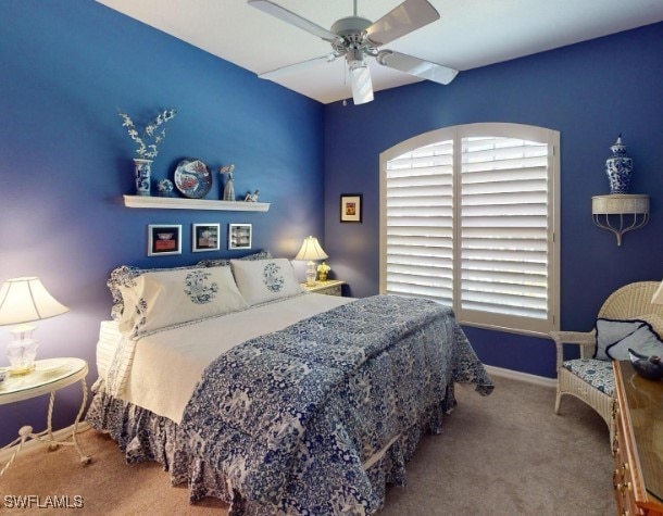 5291 Laurel Oak Ct, North Port, FL 34287 - carpeted bedroom with baseboards and ceiling fan