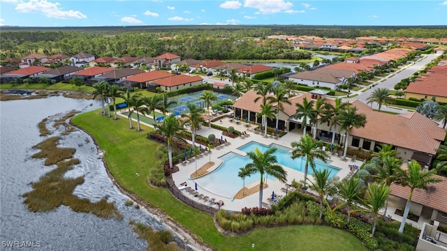 birds eye view of property featuring a water view