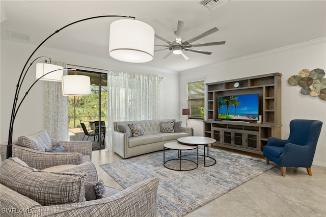 living room featuring ornamental molding and ceiling fan