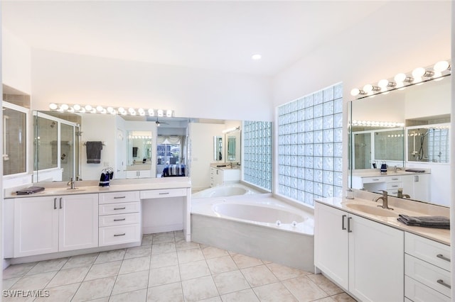 bathroom with vanity, independent shower and bath, and tile patterned flooring