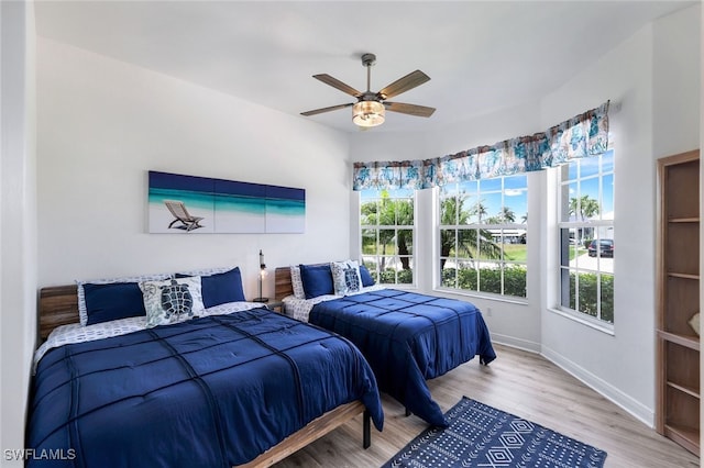 bedroom featuring ceiling fan and light wood-type flooring