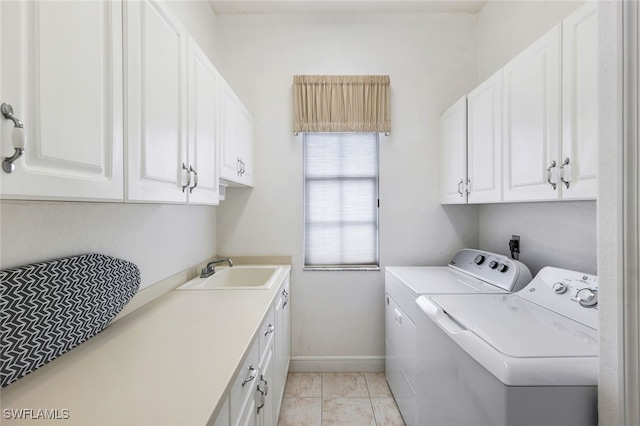1524 SW 56th Ter, Cape Coral, FL 33914 - clothes washing area with cabinet space, baseboards, washing machine and dryer, and a sink