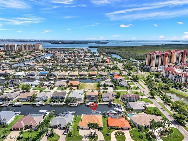 birds eye view of property featuring a water view