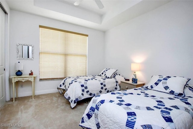 15801 Prentiss Pointe Cir Unit 102, Fort Myers, FL 33908 - bedroom with a raised ceiling, a closet, carpet, baseboards, and ceiling fan