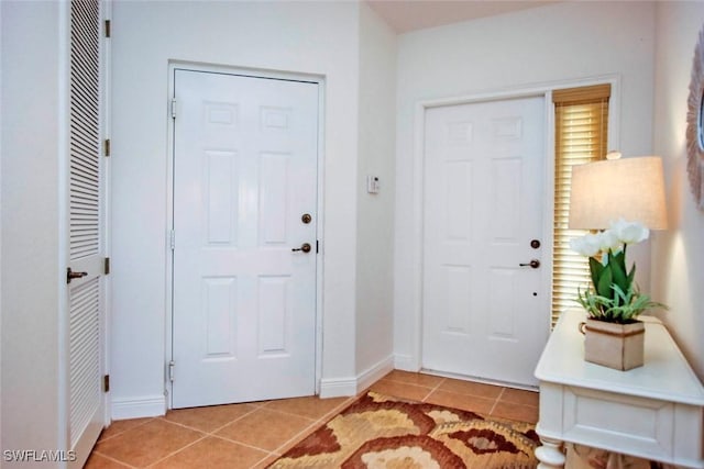15801 Prentiss Pointe Cir Unit 102, Fort Myers, FL 33908 - foyer entrance featuring light tile patterned floors and baseboards