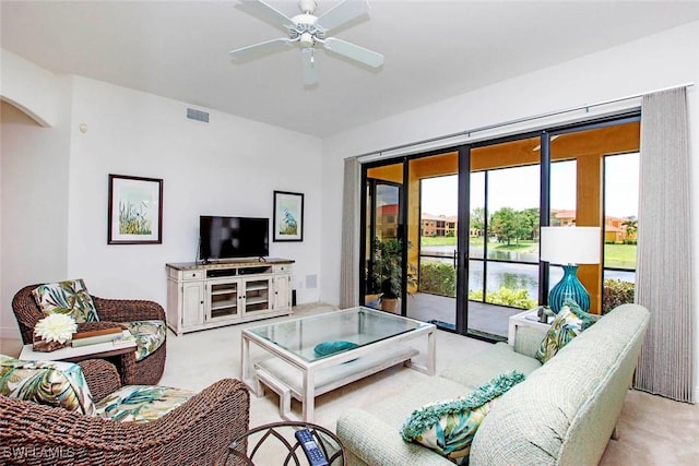 15801 Prentiss Pointe Cir Unit 102, Fort Myers, FL 33908 - living room with carpet, a ceiling fan, and arched walkways