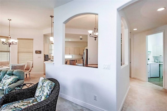15801 Prentiss Pointe Cir Unit 102, Fort Myers, FL 33908 - corridor with a chandelier, arched walkways, light colored carpet, recessed lighting, and baseboards