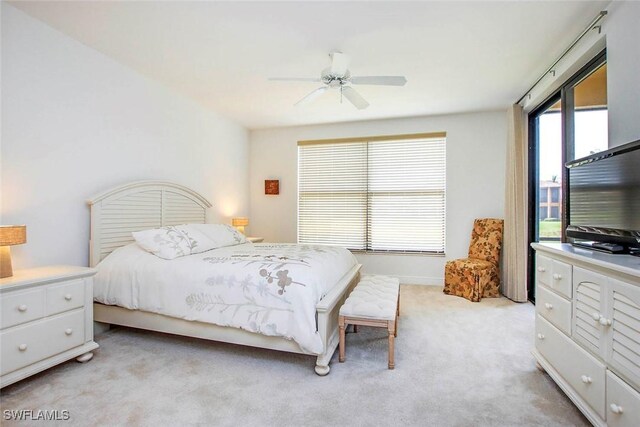 15801 Prentiss Pointe Cir Unit 102, Fort Myers, FL 33908 - bedroom with light carpet and a ceiling fan