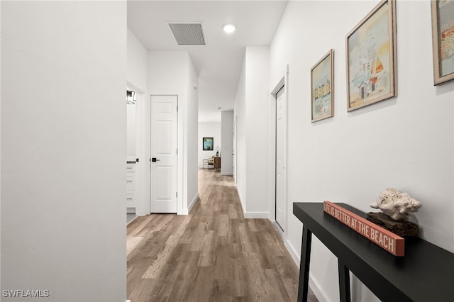 hallway featuring hardwood / wood-style flooring