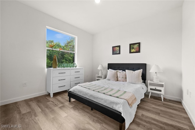 bedroom with light hardwood / wood-style floors