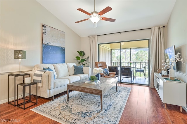 living room featuring ceiling fan, lofted ceiling, and dark hardwood / wood-style floors