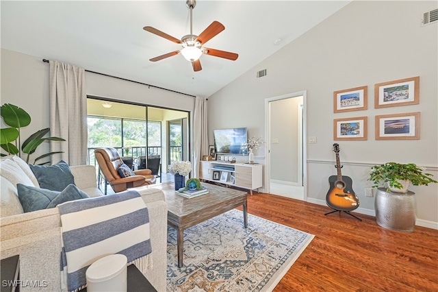 living room with high vaulted ceiling, wood-type flooring, and ceiling fan