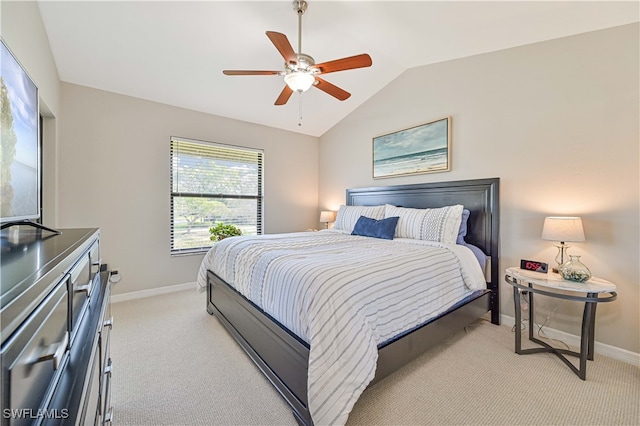 carpeted bedroom featuring lofted ceiling and ceiling fan