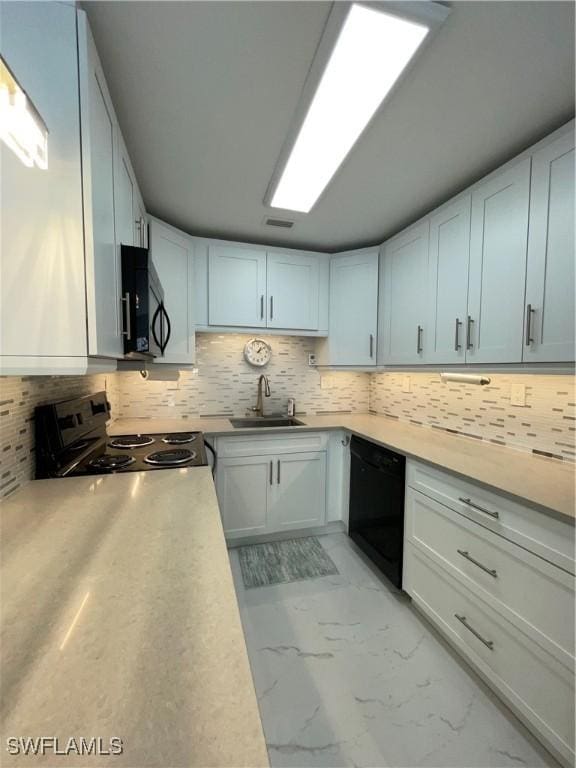 kitchen with range, white cabinetry, sink, and black dishwasher