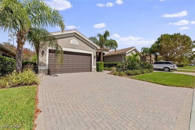 single story home featuring a front yard and a garage