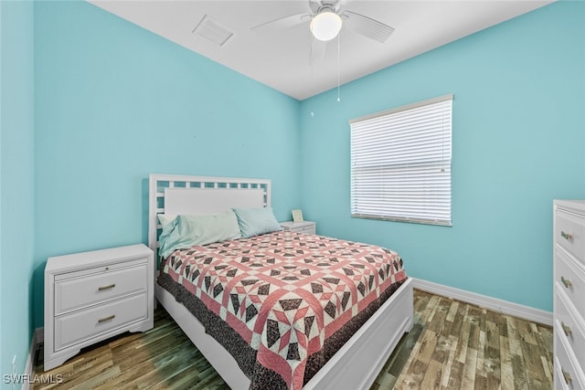 bedroom with dark wood-type flooring and ceiling fan