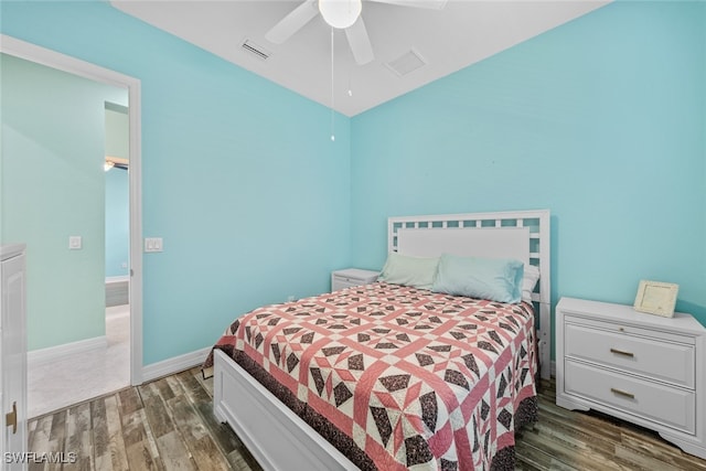 bedroom with ceiling fan and dark hardwood / wood-style floors