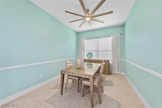 tiled dining area featuring radiator and ceiling fan