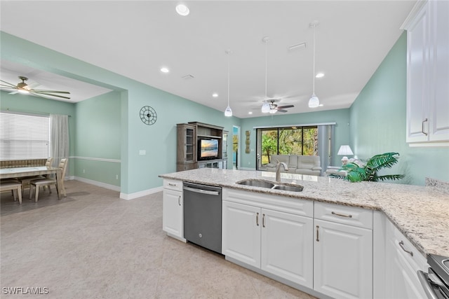 kitchen with white cabinetry, light stone counters, appliances with stainless steel finishes, and sink