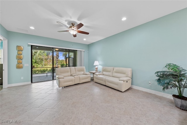 unfurnished living room featuring ceiling fan and light tile patterned flooring