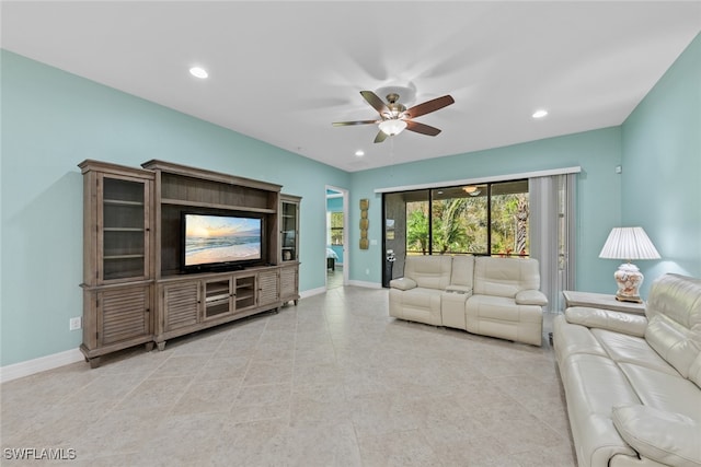 tiled living room with ceiling fan