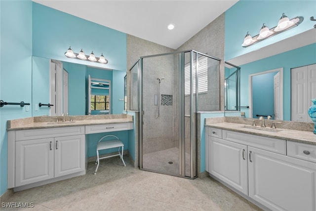 bathroom featuring vanity, tile patterned floors, and an enclosed shower