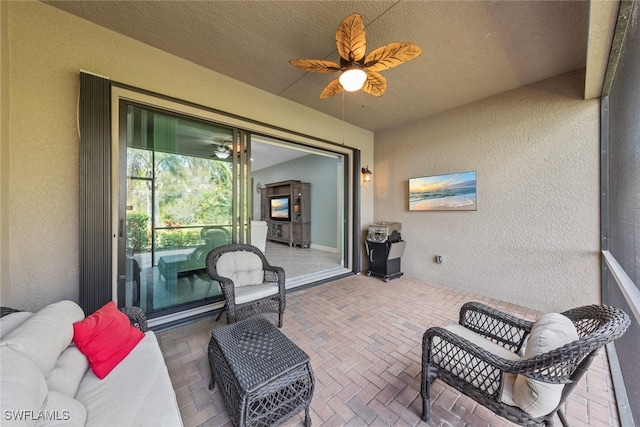 view of patio featuring ceiling fan