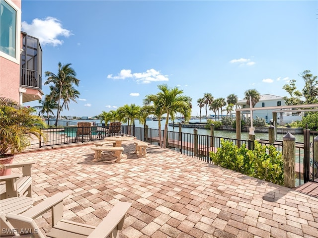 view of patio / terrace with a water view