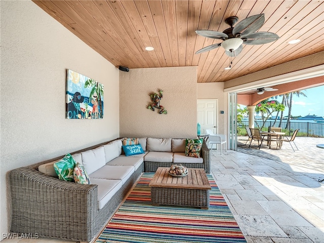 view of patio featuring an outdoor living space and ceiling fan