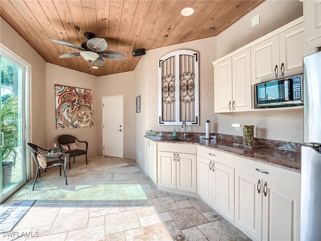 kitchen with white cabinetry, wood ceiling, sink, and appliances with stainless steel finishes