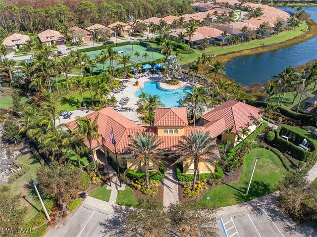 birds eye view of property with a water view