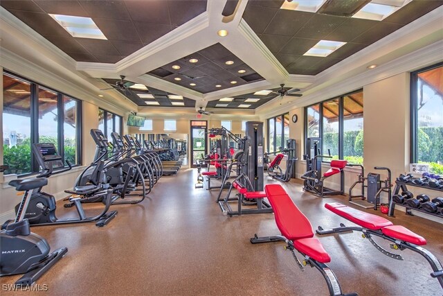 workout area featuring crown molding, coffered ceiling, ceiling fan, and a wealth of natural light