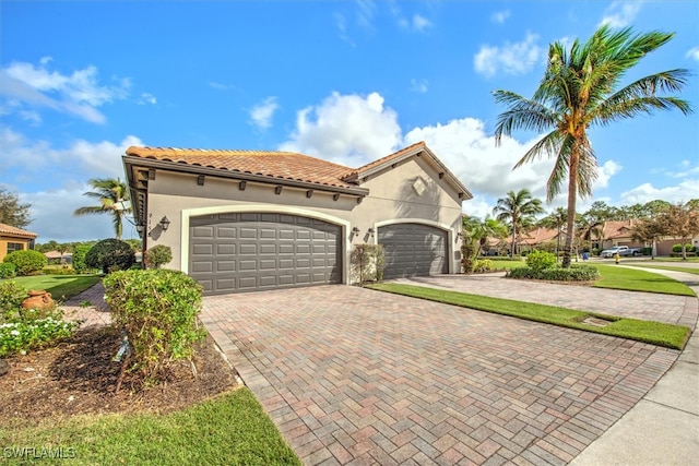 mediterranean / spanish-style house featuring a garage