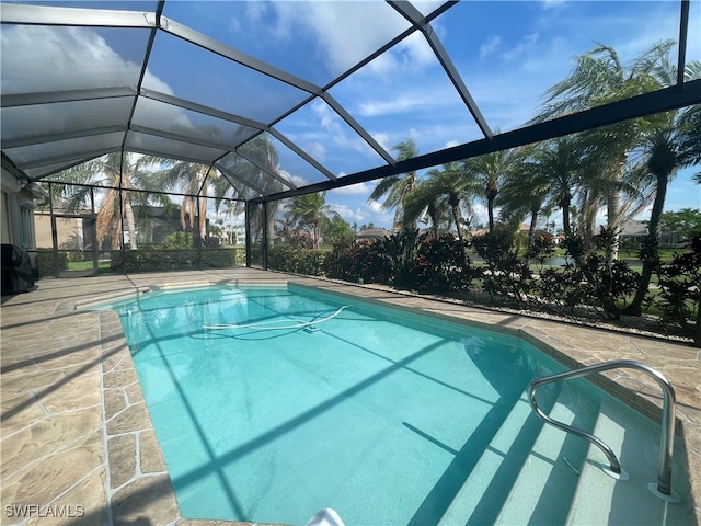 view of pool featuring a patio area and a lanai