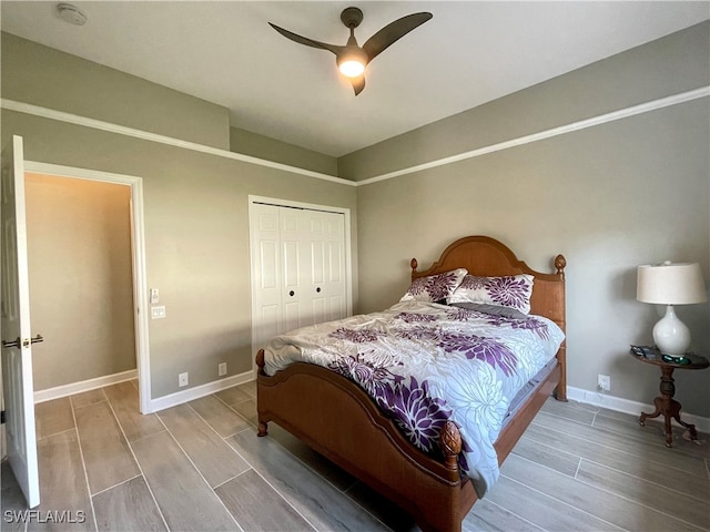 bedroom featuring hardwood / wood-style floors, ceiling fan, and a closet