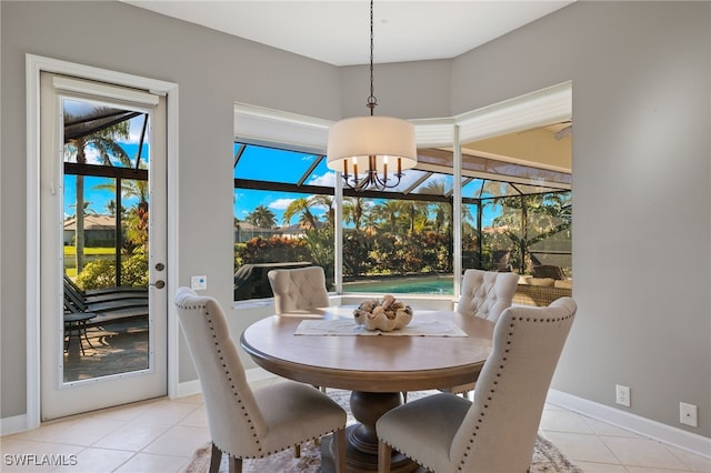 dining area featuring a notable chandelier and light tile patterned floors