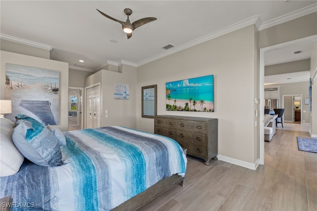 bedroom with ceiling fan, ornamental molding, and light hardwood / wood-style flooring