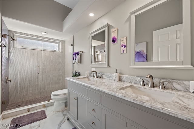 bathroom with a tile shower, vanity, and toilet