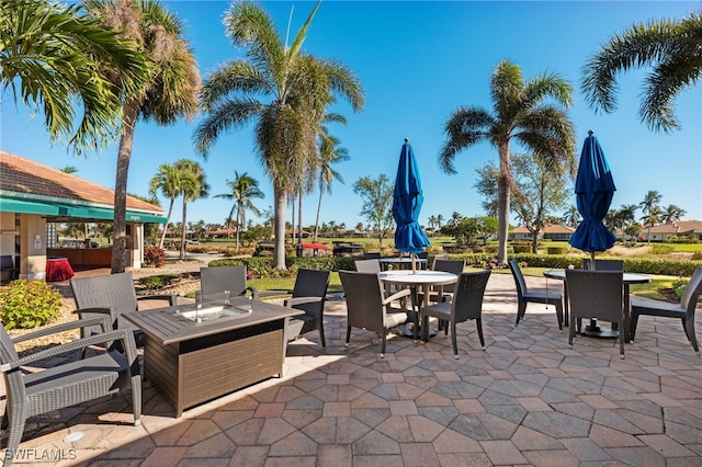 view of patio with an outdoor fire pit