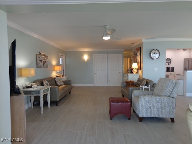 living room with ceiling fan, ornamental molding, and light wood-type flooring