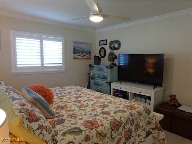 bedroom with ceiling fan and ornamental molding