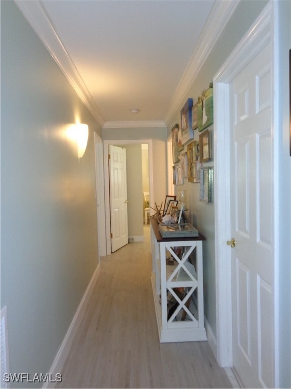 hall featuring crown molding and wood-type flooring