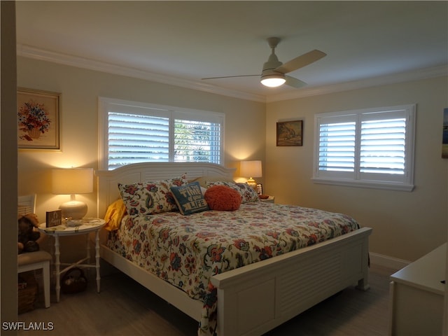 bedroom with ceiling fan, ornamental molding, multiple windows, and dark hardwood / wood-style floors