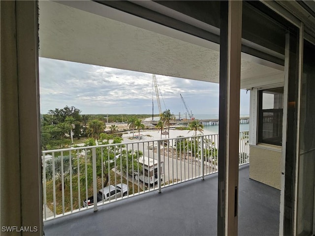 balcony featuring a water view