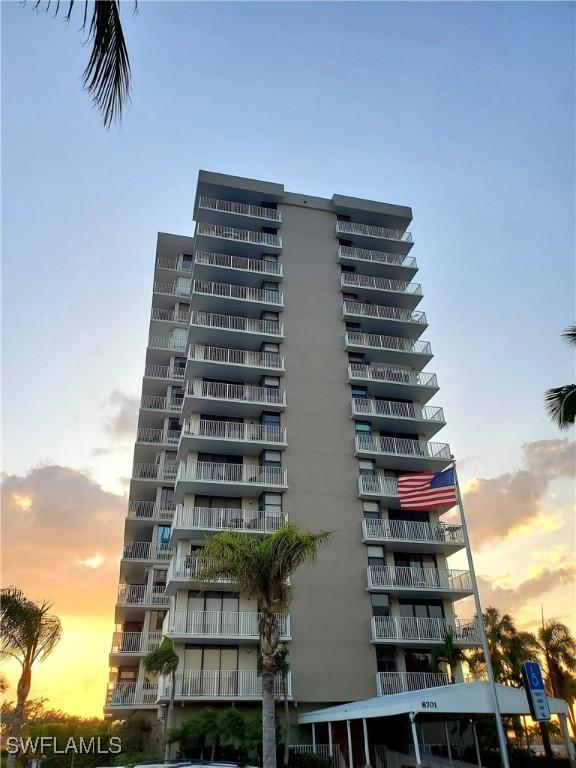 view of outdoor building at dusk